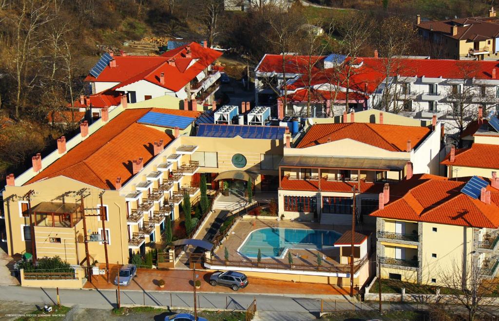 an overhead view of a house with red roofs at 4 Epoxes Hotel Spa in Kato Loutraki
