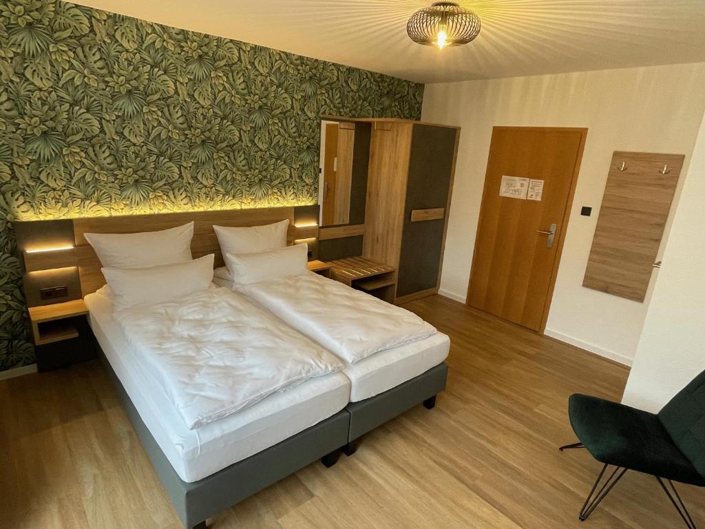 Postel nebo postele na pokoji v ubytování Gasthaus Kirchhoff