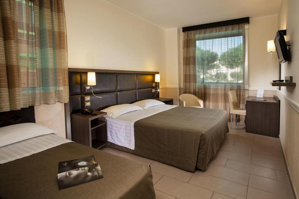Postel nebo postele na pokoji v ubytování Hotel Artis