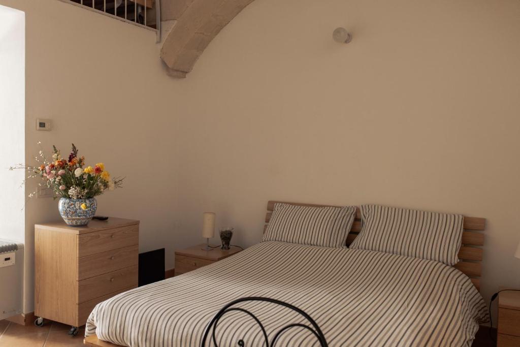 Postel nebo postele na pokoji v ubytování Il Vicinato, casa vacanza immersa nel cuore dei Sassi