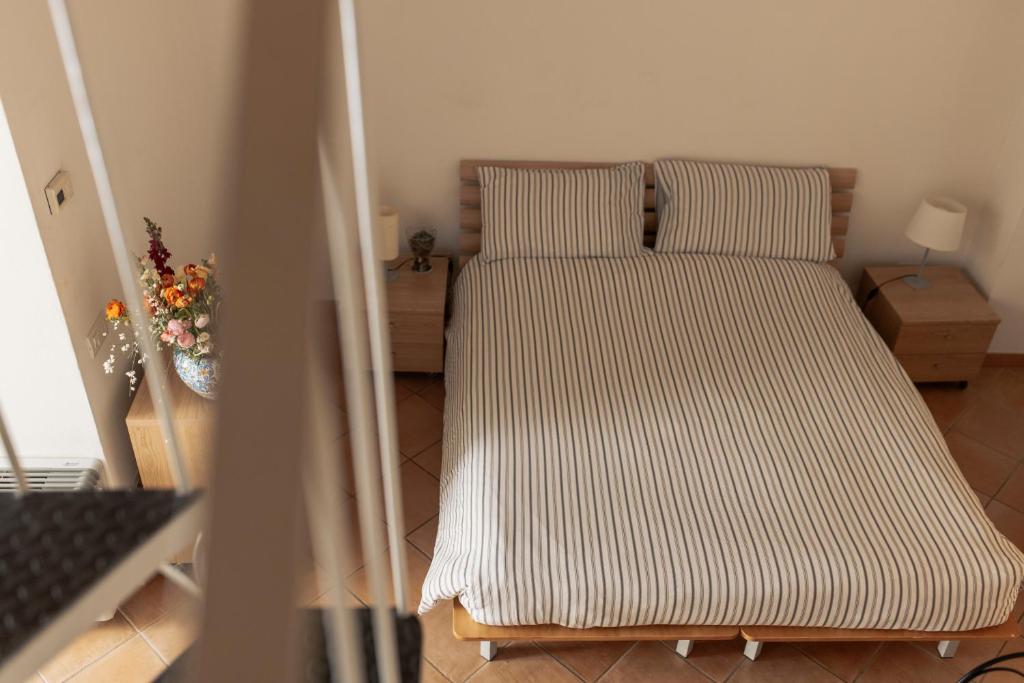 Postel nebo postele na pokoji v ubytování Il Vicinato, casa vacanza immersa nel cuore dei Sassi