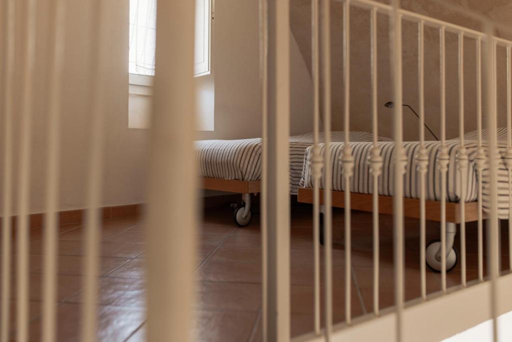 Postel nebo postele na pokoji v ubytování Il Vicinato, casa vacanza immersa nel cuore dei Sassi