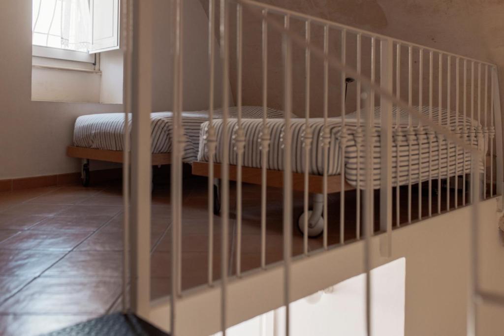 Postel nebo postele na pokoji v ubytování Il Vicinato, casa vacanza immersa nel cuore dei Sassi