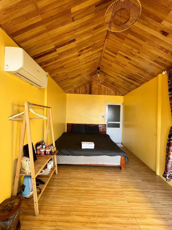 Postel nebo postele na pokoji v ubytování May Home Tà Xùa