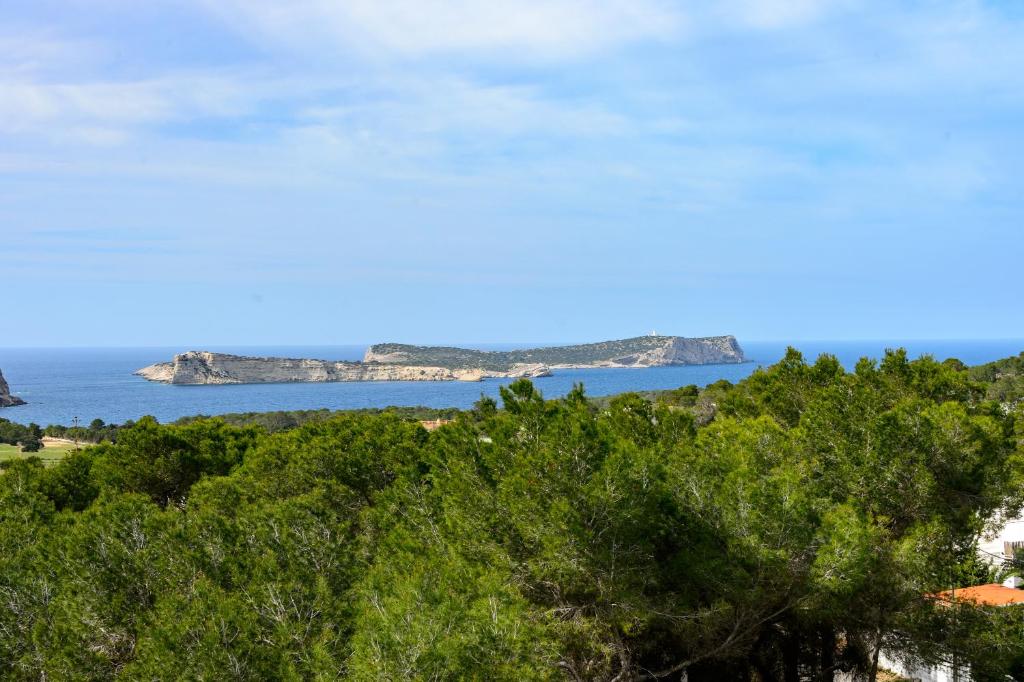 a view of the ocean and islands in the distance at Casa Juliarina in Sant Josep de sa Talaia