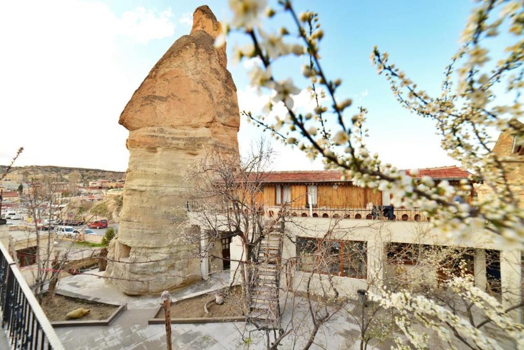 an old building with a chimney on top of it at Peri Cave Hotel in Goreme