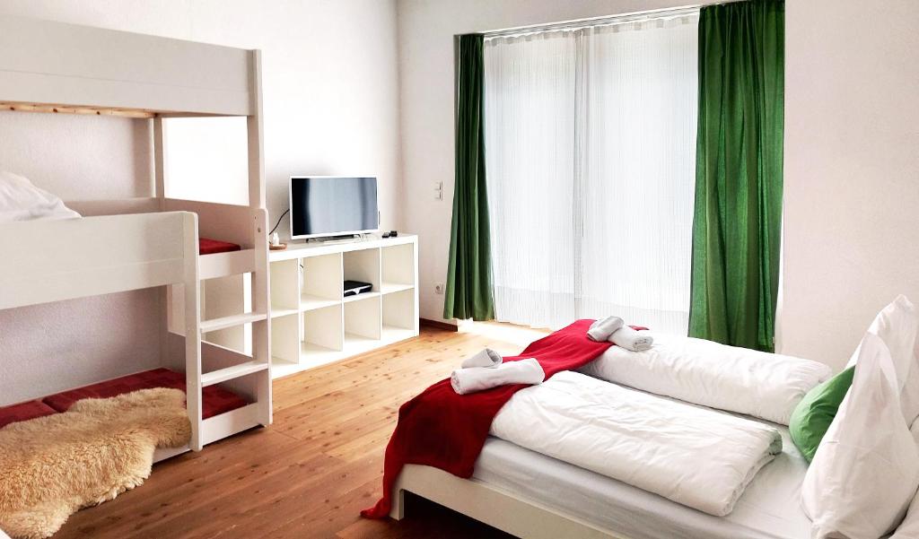 Posteľ alebo postele v izbe v ubytovaní aeki LOFT