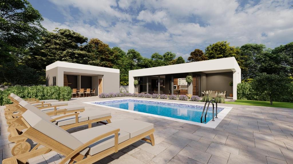 ein Swimmingpool mit Stühlen und ein Haus in der Unterkunft Green Luxury with heated pool, jacuzzi & sauna in Ružići