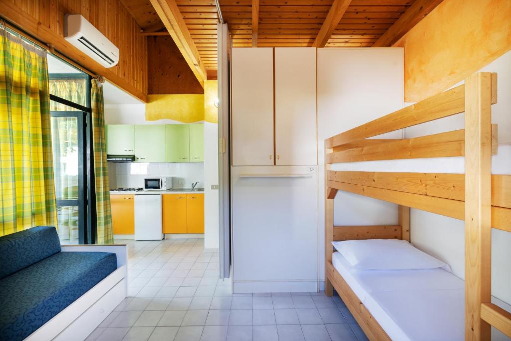 Postel nebo postele na pokoji v ubytování Residence Mare Pineta
