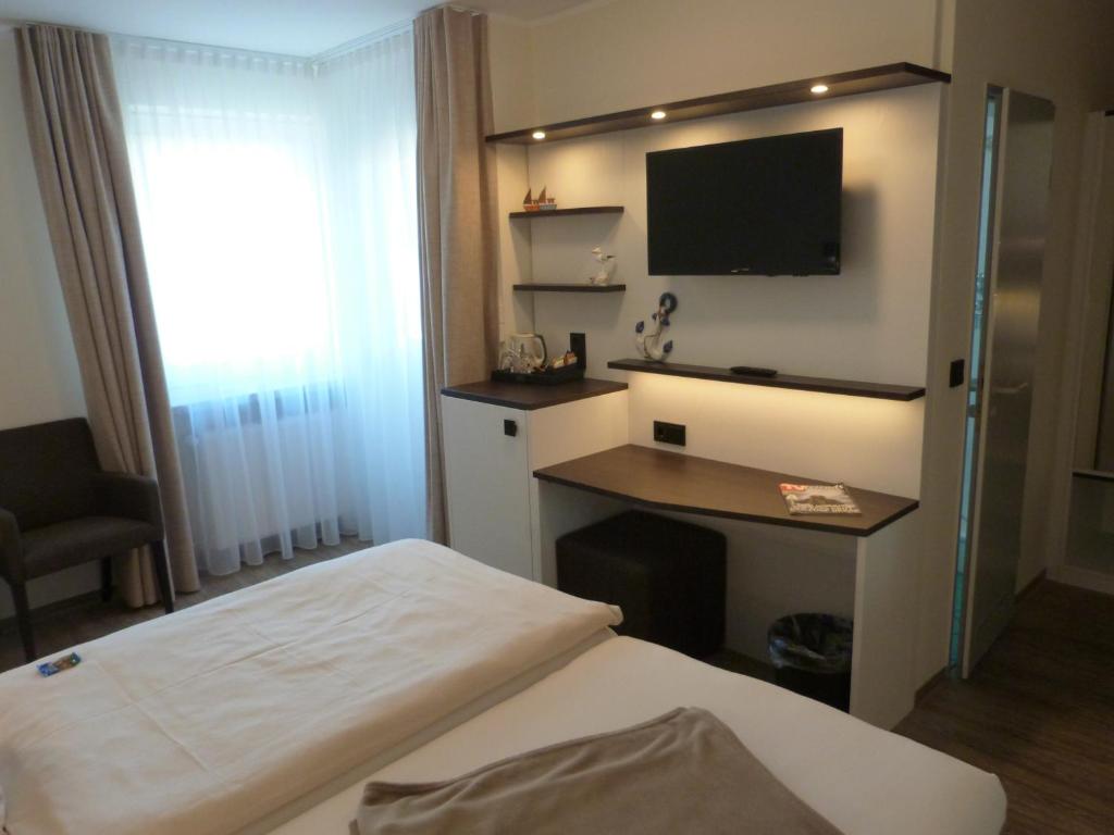 Postel nebo postele na pokoji v ubytování ankerplatz-Hotel garni