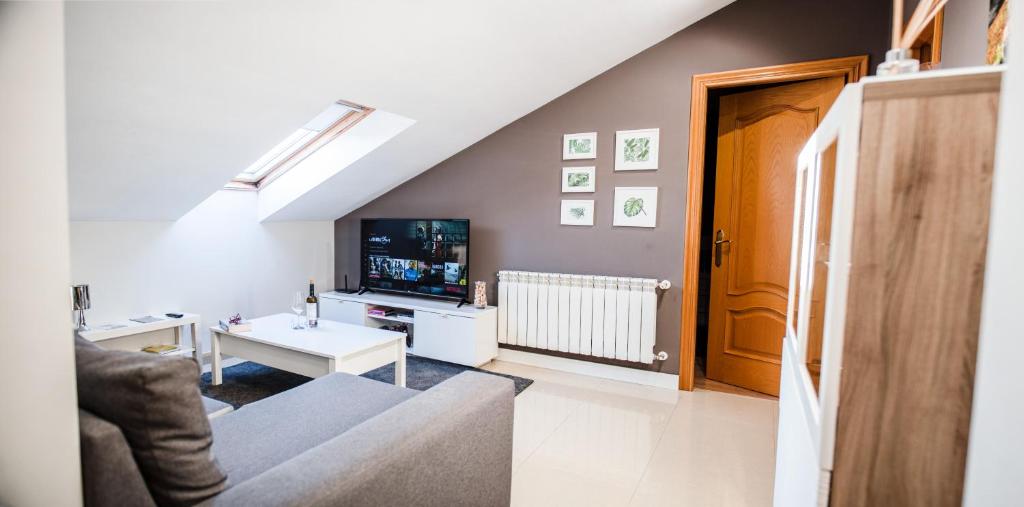 Telewizja i/lub zestaw kina domowego w obiekcie Apartamento Cuatro Caminos