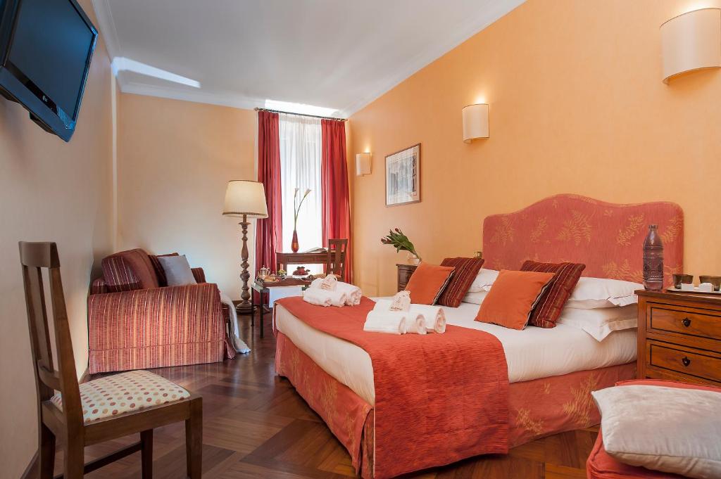 A bed or beds in a room at All'Orologio