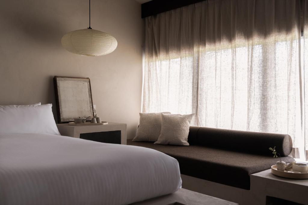 Postel nebo postele na pokoji v ubytování Maana Kiyomizu
