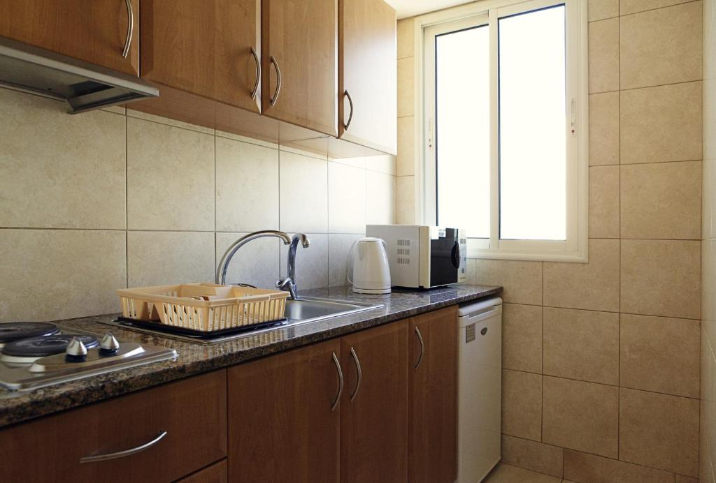 a kitchen with a sink and a counter top at X1 by Smallville in Beirut