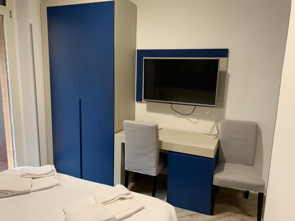 TV a/nebo společenská místnost v ubytování Guesthouse Ughetti 21
