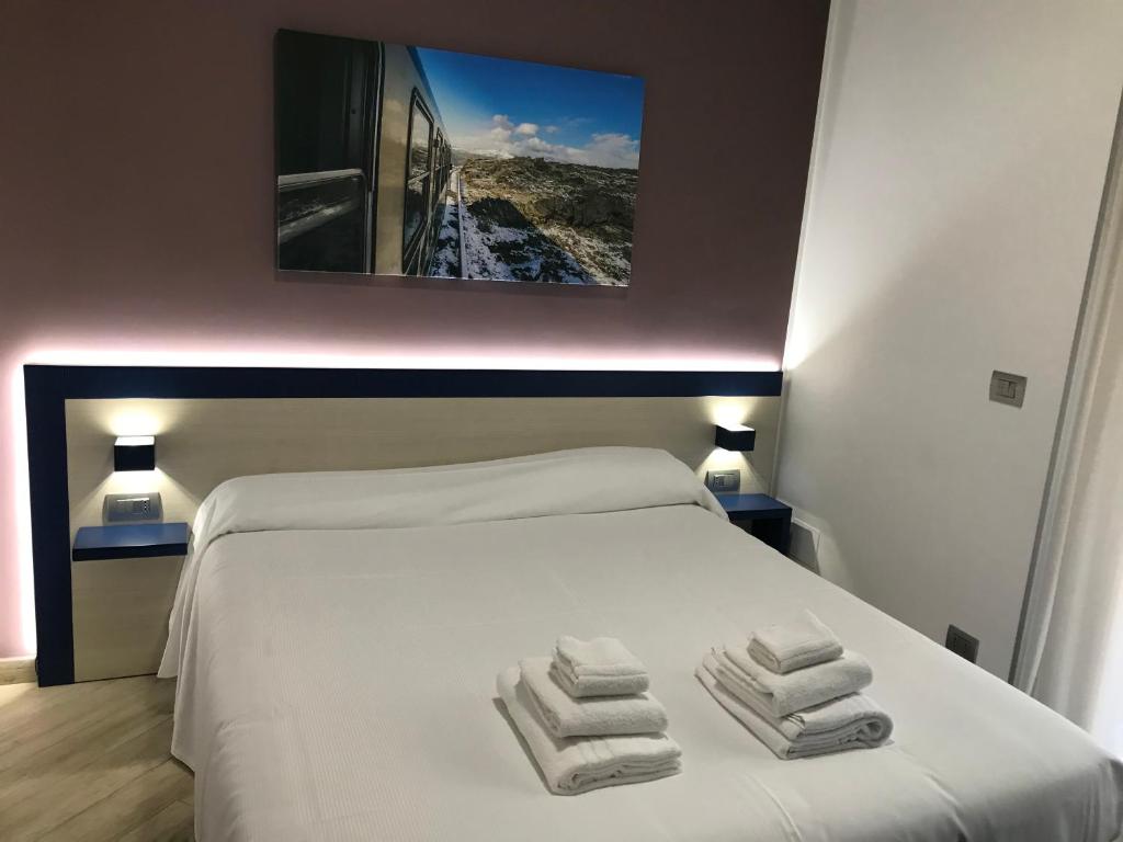 Postel nebo postele na pokoji v ubytování Guesthouse Ughetti 21