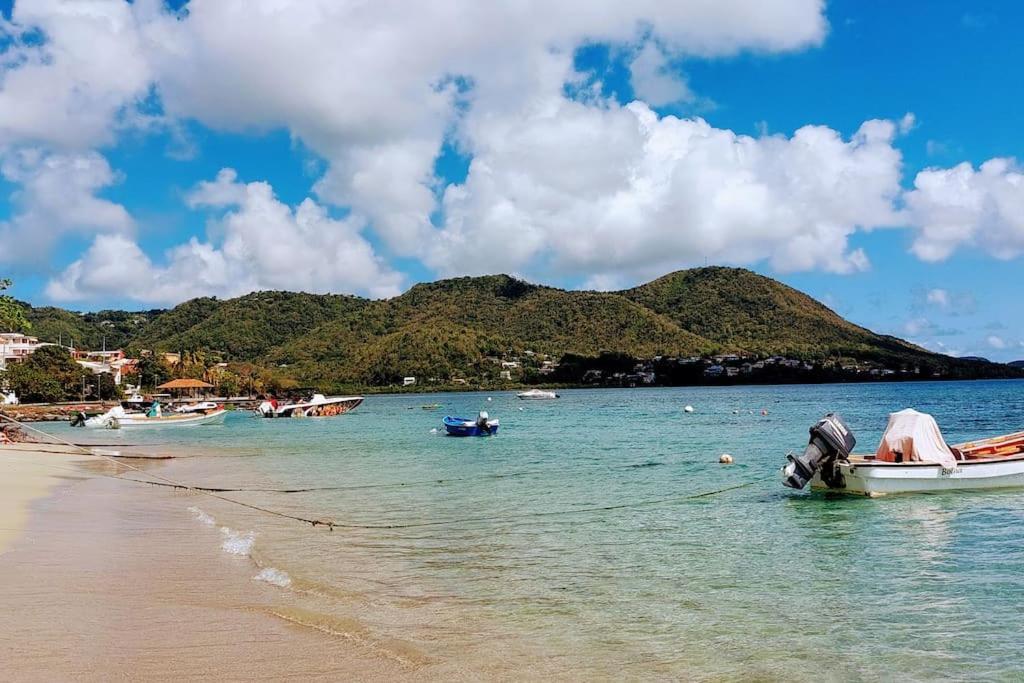 a group of boats in the water on a beach at Studio &quot;Prestige&quot; Sainte Luce in Sainte-Luce