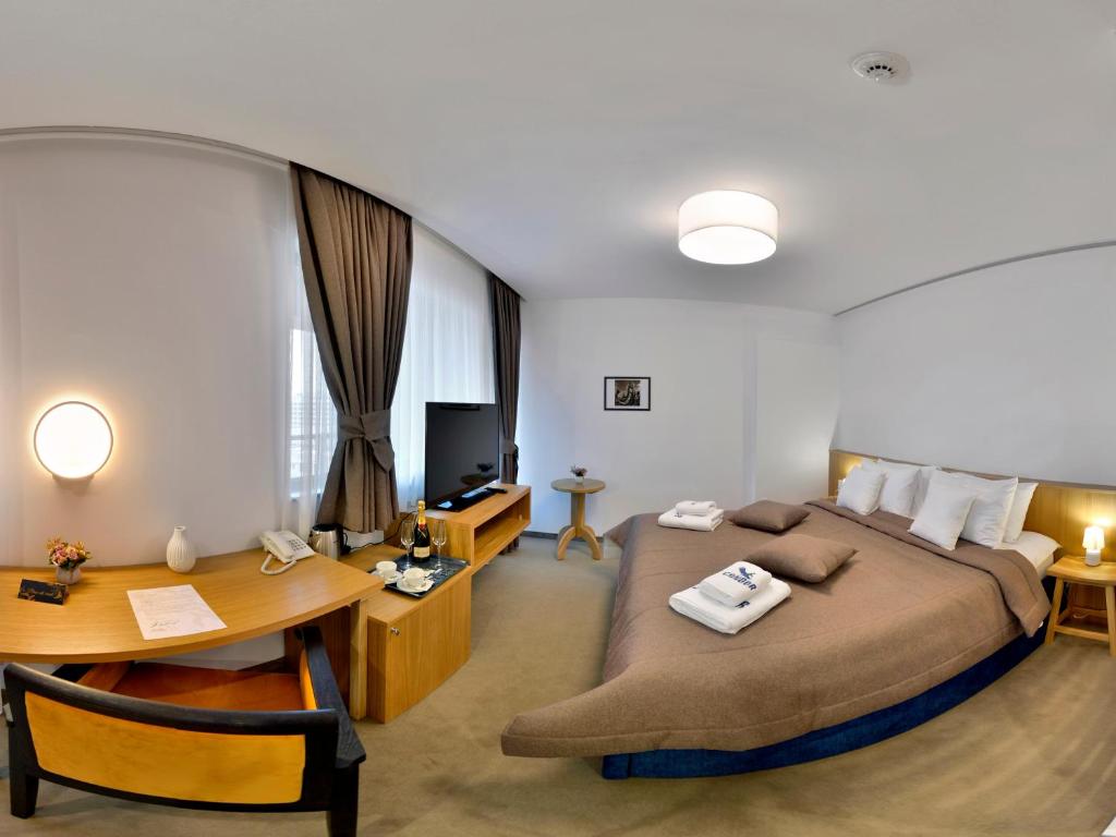Postel nebo postele na pokoji v ubytování Hotel Condor Tulcea