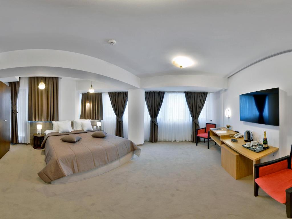 Postel nebo postele na pokoji v ubytování Hotel Condor Tulcea