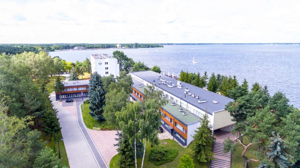 an aerial view of a building next to the water at Rewita Rynia in Białobrzegi