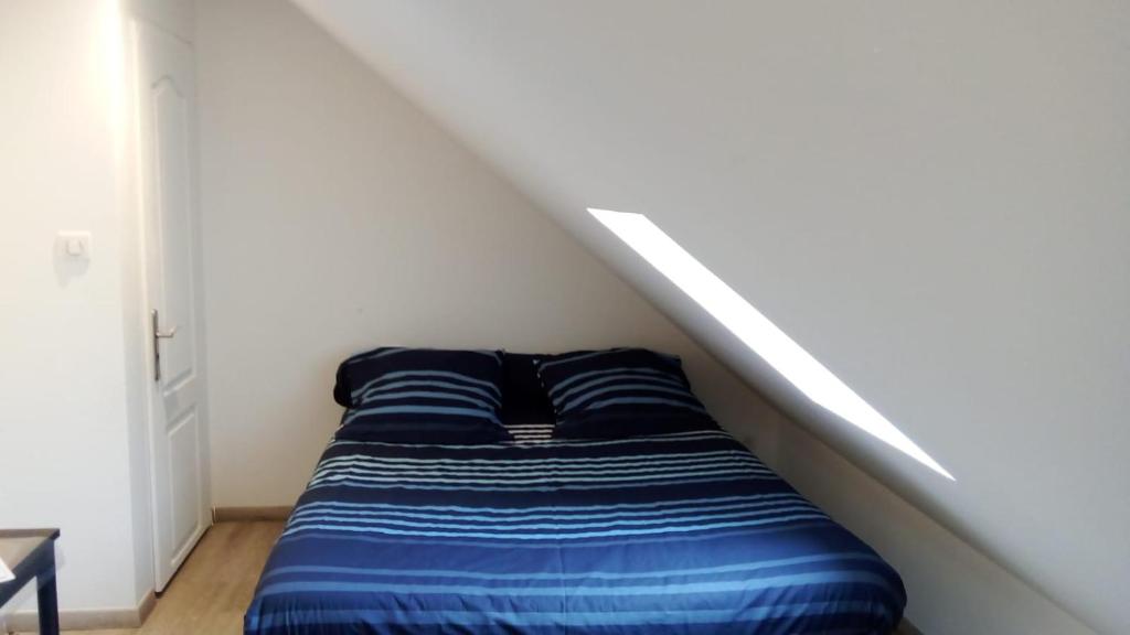 Кровать или кровати в номере Le Relais de Louis