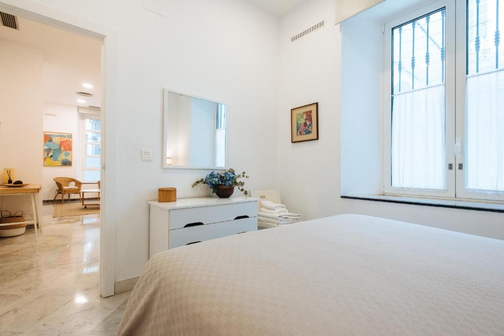 Łóżko lub łóżka w pokoju w obiekcie Apartamento cerca de la catedral