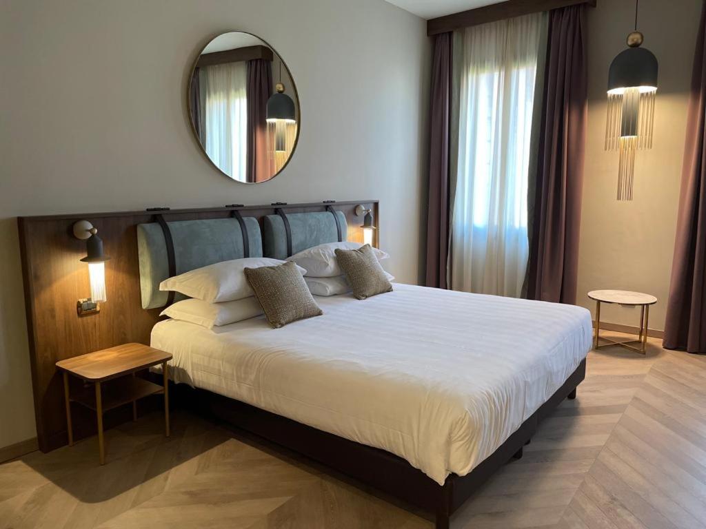 A bed or beds in a room at Ca' Vendramin Zago