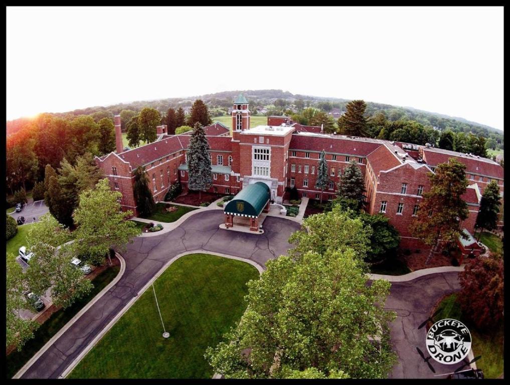 an aerial view of a large brick building at The Bertram Inn at Glenmoor in Canton