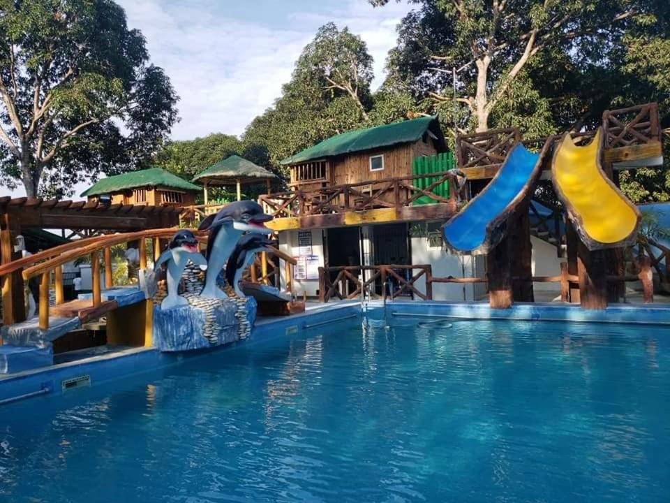 a water park with a water slide and a water slide slide at Villa Lenda Resort - San Manuel, Pangasinan 