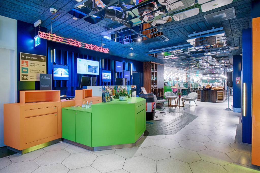 a store with colorful counters and tables in a room at ibis Styles Warszawa Centrum in Warsaw
