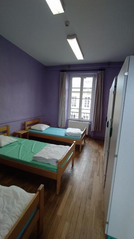 Postel nebo postele na pokoji v ubytování Logis des Grands Chapeaux