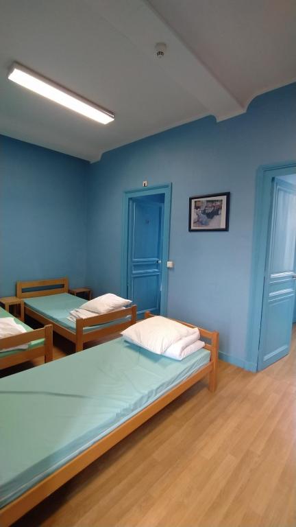 Postel nebo postele na pokoji v ubytování Logis des Grands Chapeaux