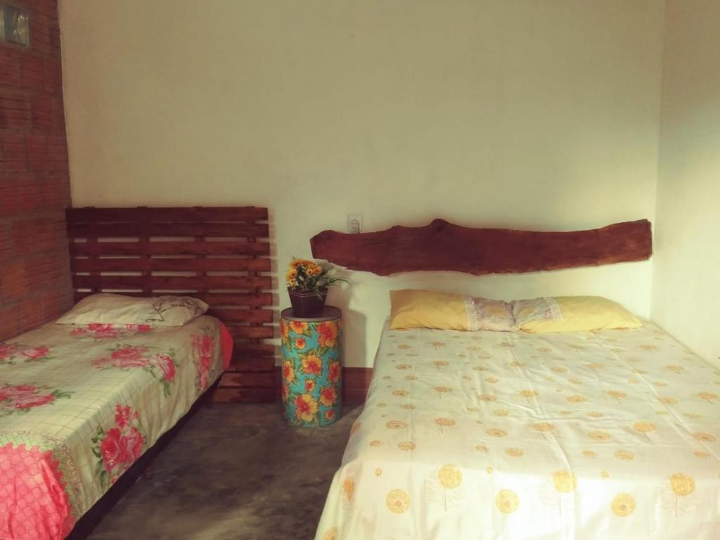 מיטה או מיטות בחדר ב-Sítio Estrela da Manhã