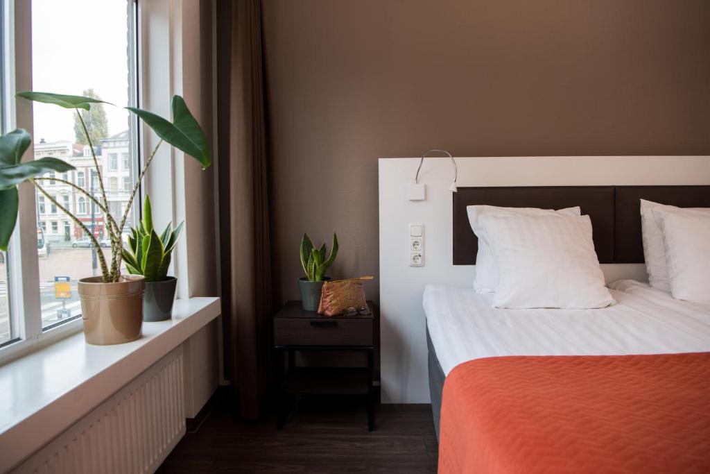 Letto o letti in una camera di Hotel Emma