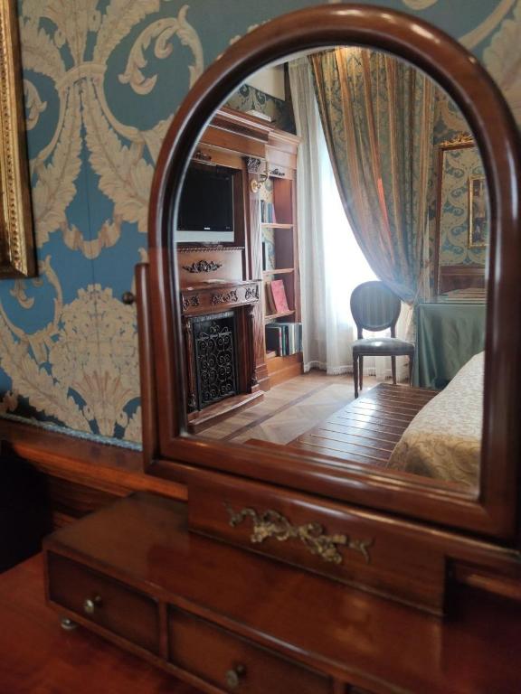 Łóżko lub łóżka w pokoju w obiekcie Bellevue Luxury Rooms - San Marco Luxury