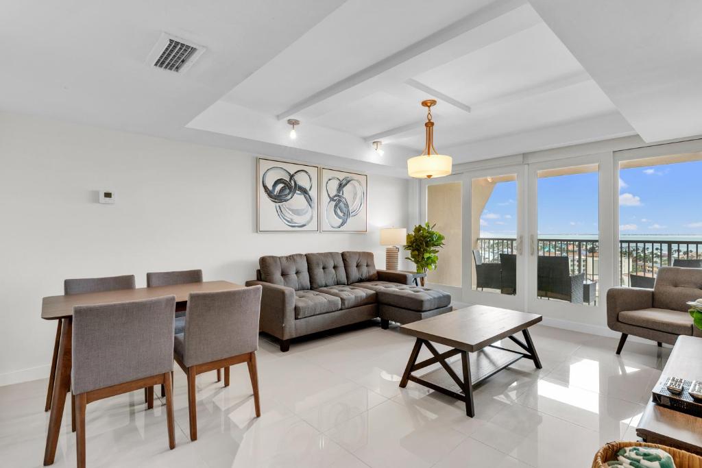 a living room with a couch and a table at Panoramic Island View! NEW 1 BR spacious condo in beachfront resort in South Padre Island