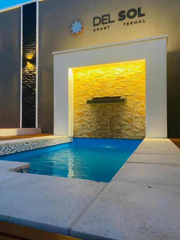 a swimming pool in the middle of a building at DEL SOL APART TERMAL II in Termas de Río Hondo