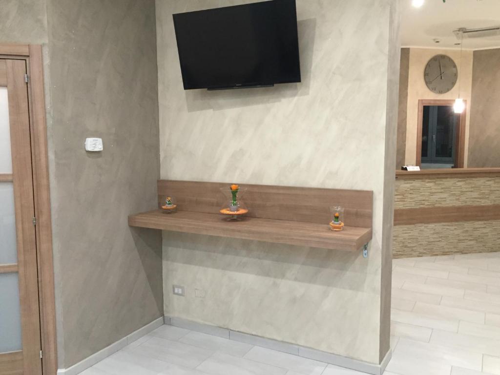 TV a/nebo společenská místnost v ubytování Hotel Montecarlo