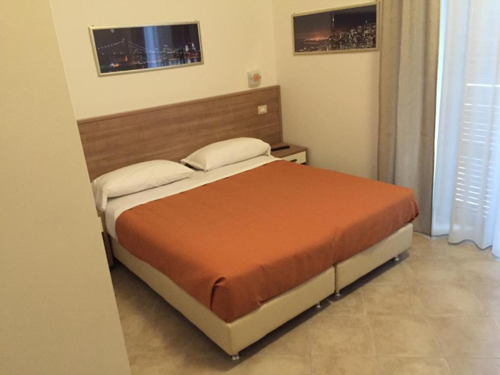 Postel nebo postele na pokoji v ubytování Hotel Montecarlo
