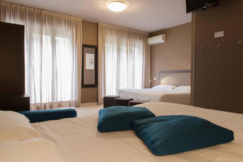 Postel nebo postele na pokoji v ubytování M14 Hotel & Spa