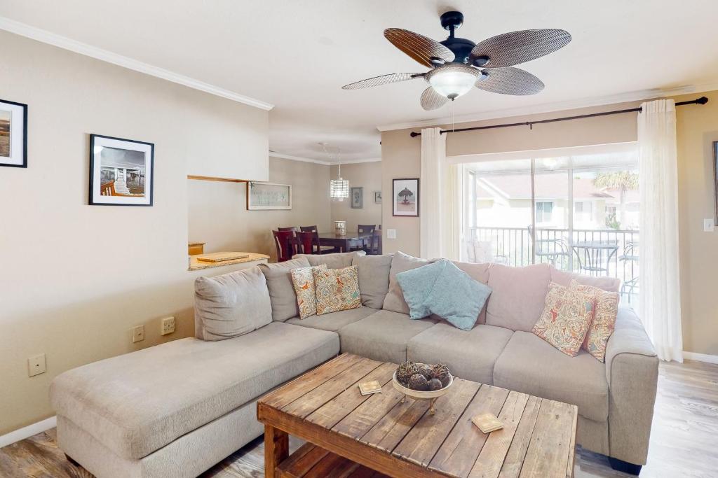 a living room with a couch and a table at Bermuda Bay Beach & Racquet Club, Unit E in St Petersburg