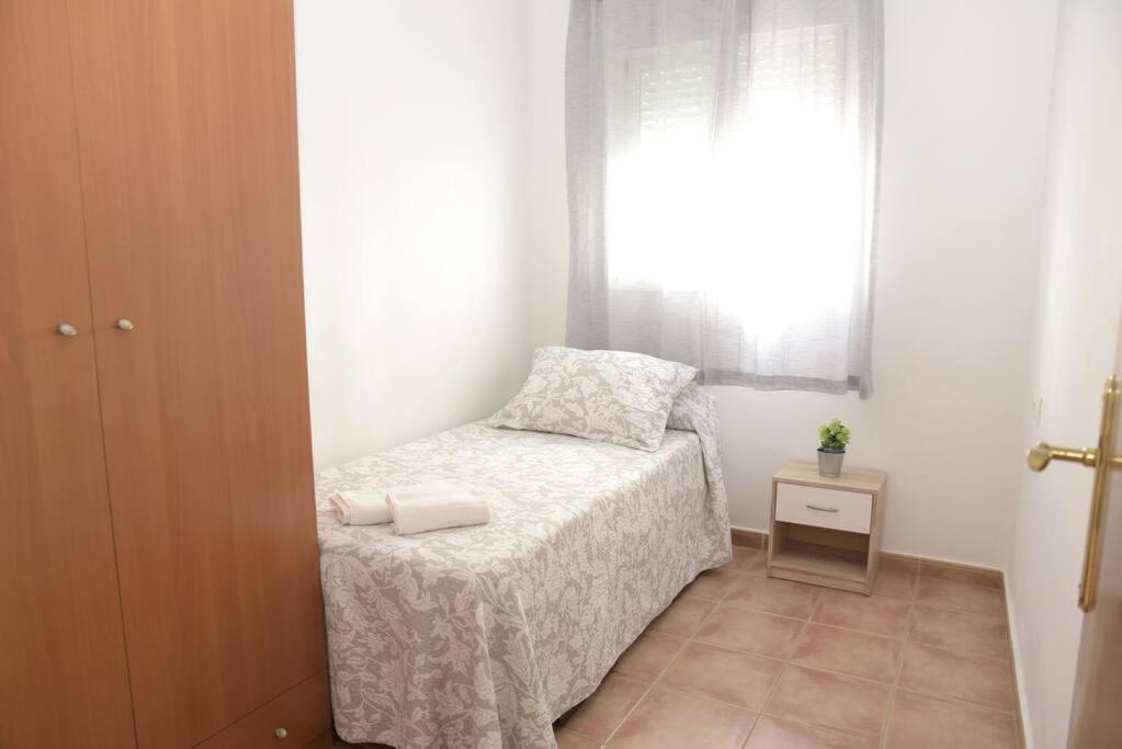 Posteľ alebo postele v izbe v ubytovaní Apartamento Elena - Sólo Familias y Parejas