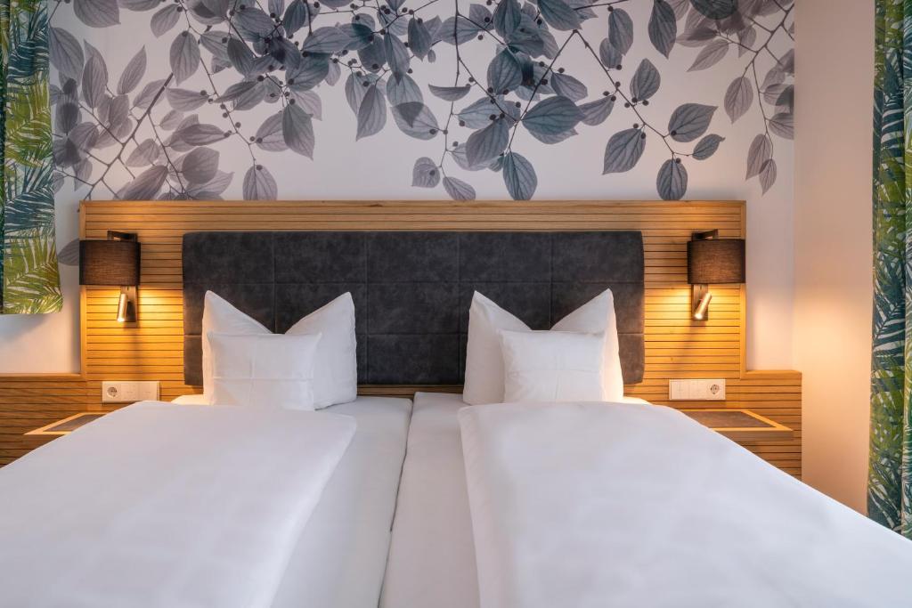 Postel nebo postele na pokoji v ubytování Hotel Lipprandt