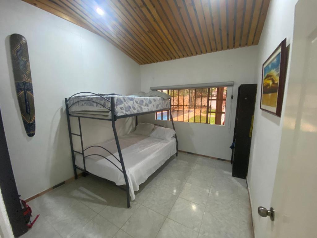 Postel nebo postele na pokoji v ubytování Casa de descanso acacias meta