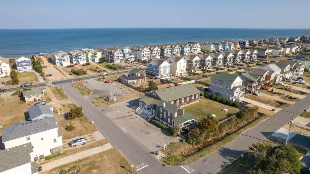 an aerial view of a city with houses and the ocean at Nags Head Beach Inn by KEES Vacations in Nags Head