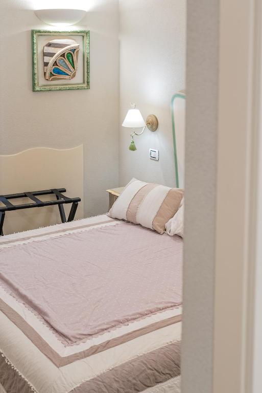 A bed or beds in a room at Affittacamere Irene