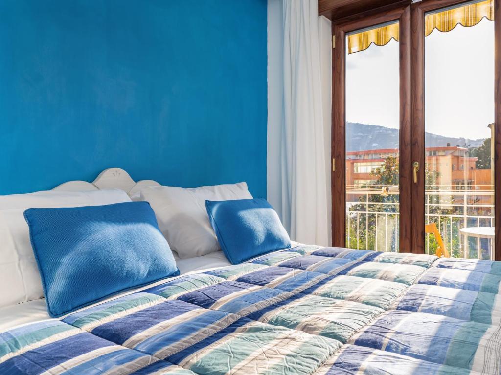 Postel nebo postele na pokoji v ubytování Amore&Psiche - De Vivo Realty Sorrento