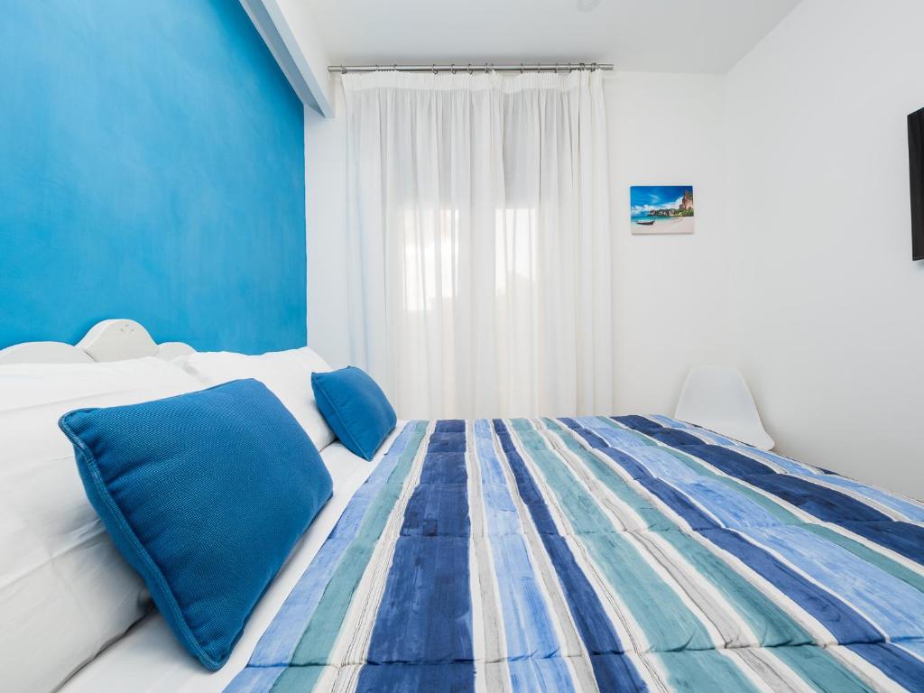 Postel nebo postele na pokoji v ubytování Amore&Psiche - De Vivo Realty Sorrento