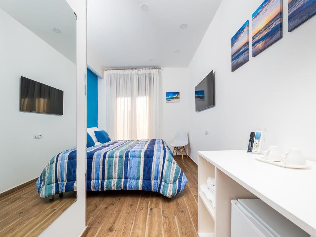 Postel nebo postele na pokoji v ubytování Amore&Psiche - De Vivo Realty Sorrento