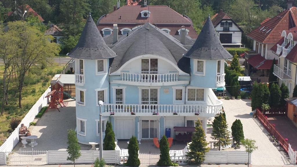 an aerial view of a large house with turrets at Crystal és Susanne Panzió in Siófok